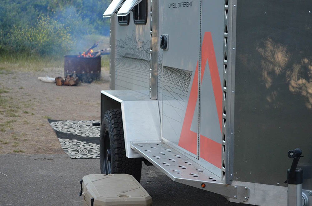 Camping trailer with fire in the woods