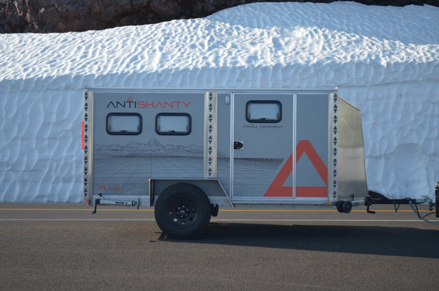 Aluminum travel trailer in snow